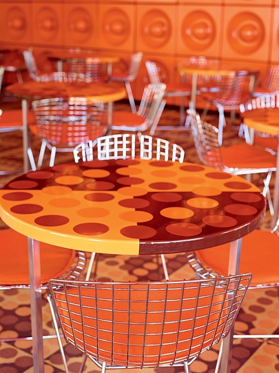 Spiegel Magazine Canteen: Spiegel canteen space  with orange tables and metal chairs.